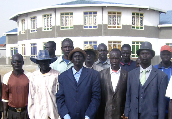 The Makolchuei Community members pose for a photo outside the newly constructed church in Bor County [©Gurtong]