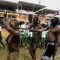 Mundari traditional dancers and school pupils marching past the podium where President kiir delivered his speech in Juba [©Gurtong]