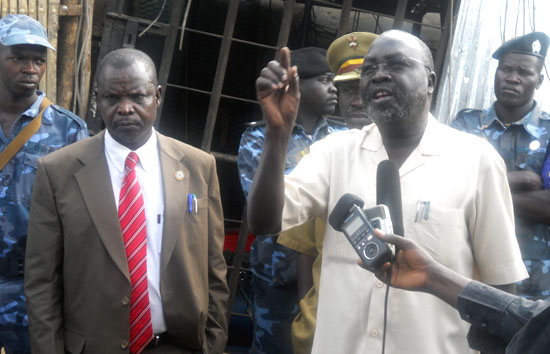 (L-R) Juba Deputy Mayor and Mayor (speaking) at Konyokonyo market as traders count their losses in rubble after a fire accident on Thursday [©Gurtong]