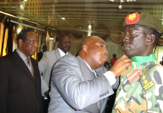 The UN Security Council Representative Mr. Abou dressing up the RTF Deputy Commander Col. Gabriel Ayou during the mission's launch in Juba [©Gurtong]