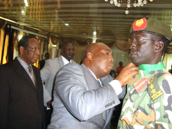 The UN Security Council Representative Mr. Abou dressing up the RTF Deputy Commander Col. Gabriel Ayou during the mission's launch in Juba [©Gurtong]