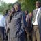 Dr Riek Machar Teny (wearing white hat) with Governor Kuol Manyang (extreme right in a tie) standing along River Nile looking at a cattle camp with other State officials [Gurtong]