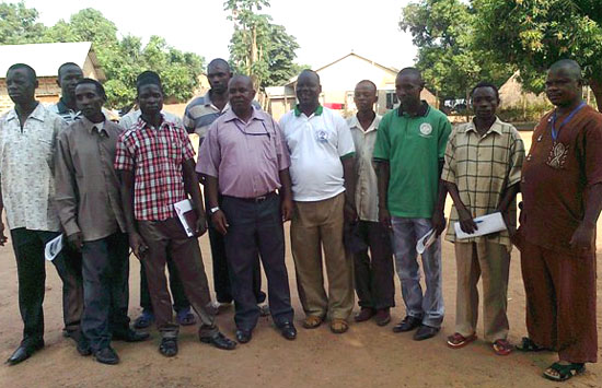 Workshop participants pose for a group photo. (at the centre, wearing white t-shirt) Mr. Lambert Okure Drata [©Gurtong]