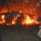 Traders try to extinguish the fierce fire from spreading to other business premises at Konyokonyo market in Juba [©Gurtong]