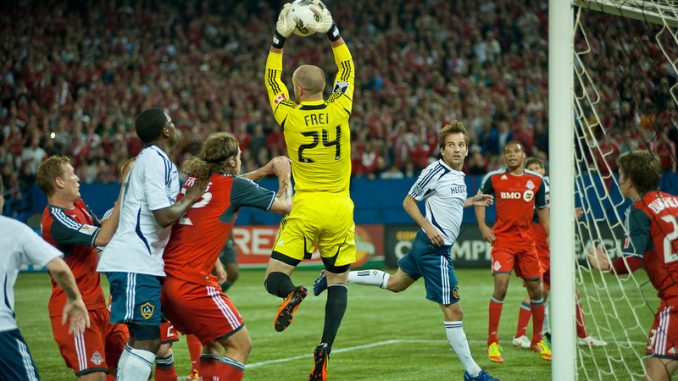 Toronto FC goalkeeper Stefan Frei leaps up to grab one of many corner kicks from David Beckham. TFC played to a 2-2 draw in front of 47,658 fans Wednesday night at the Rogers Centre (John Lucero)