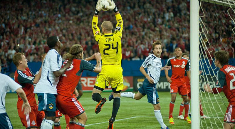 Toronto FC goalkeeper Stefan Frei leaps up to grab one of many corner kicks from David Beckham. TFC played to a 2-2 draw in front of 47,658 fans Wednesday night at the Rogers Centre (John Lucero)