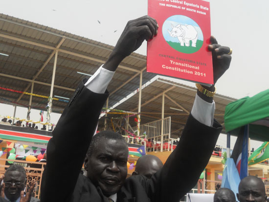 Governor Clement Wani Konga waves the signed state constitution in Juba [©Gurtong/ Juma J. Stephen]