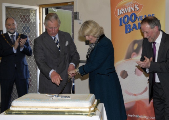 Prince of Wales & Duchess of Cornwall while cutting the anniversary cake at Irwin's Bakery Prince of Wales & Duchess of Cornwall while cutting the anniversary cake at Irwin's Bakery