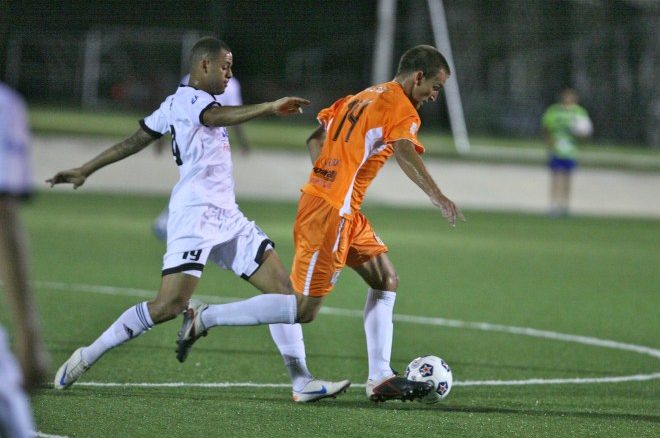 FC Edmonton's Kyle Porter fights for a ball against the Puerto Rico Islanders' Jared Van Schaik in Bayamon on Wednesday evening. The two teams battled to 0-0 draw, the Eddies' first point of the season.