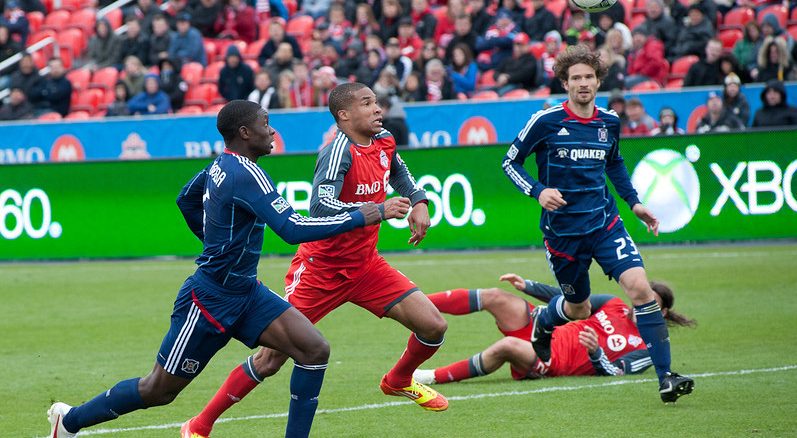Toronto FC striker Ryan Johnson (middle) and Chicago Fire Jalil Anibaba chase down a ball in the air in a match at BMO Field Saturday afternoon. Chicago prevailed with a 3-2 win prolonging TFC's woes to start the MLS season with a sixth straight loss (John Lucero)