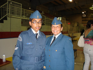 Harnoor Gill is posing with Captain Trisevyeni Kopsiafti-Parker on Annual Ceremonial Review and Change of Command at Milton Memorial Arena in Milton, Ontario on June 23, 2012