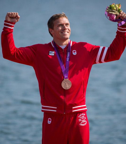 Canada's Mark de Jonge celebrates during the victory ceremony after winning a bronze medal in the K-1 200m at the 2012 London Olympic Games, August 11, 2012. The podium victory brought Canada even with its medal tally at the 2008 Beijing Games at 18. (COC Photo: Jason Ransom) Canada's Mark de Jonge celebrates during the victory ceremony after winning a bronze medal in the K-1 200m at the 2012 London Olympic Games, August 11, 2012. The podium victory brought Canada even with its medal tally at the 2008 Beijing Games at 18. (COC Photo: Jason Ransom)