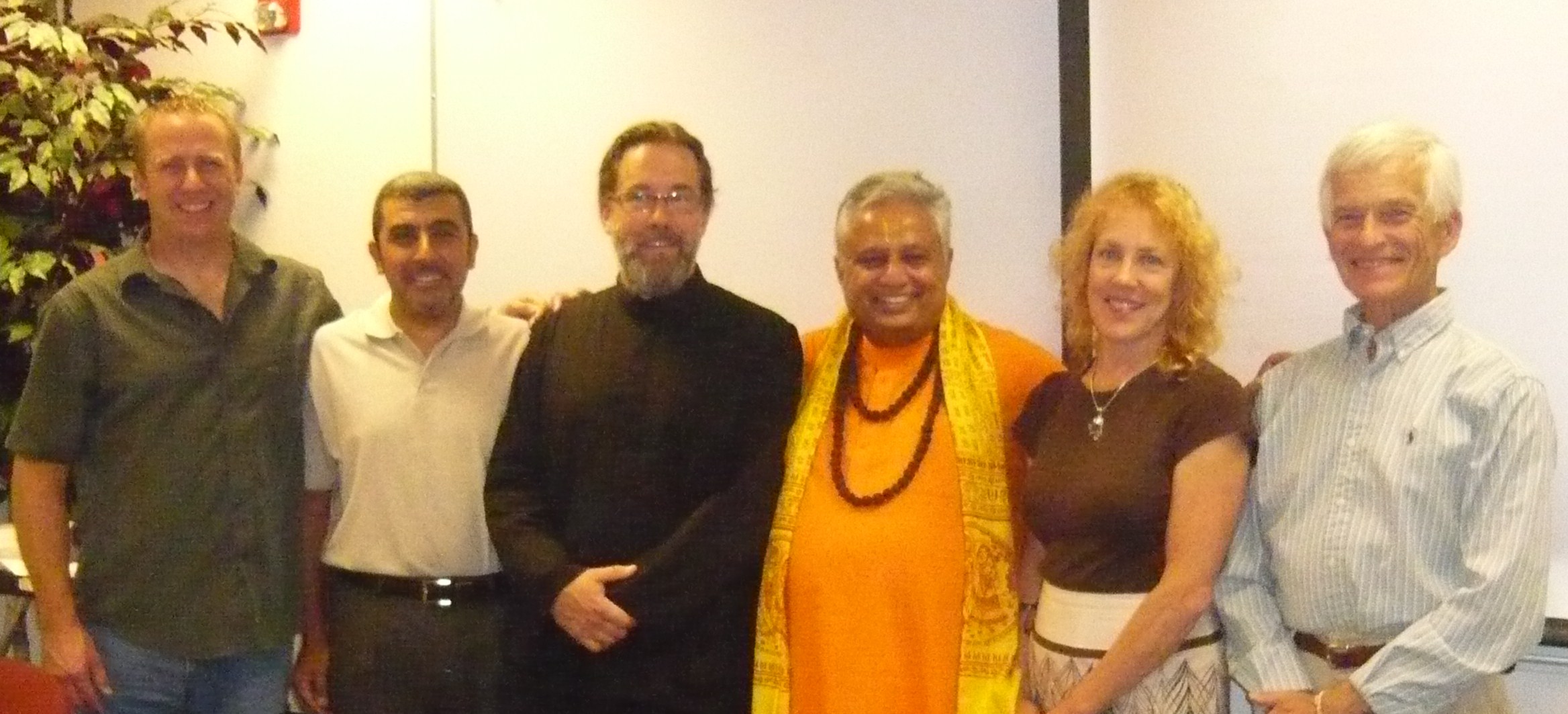 At panel discussion on “God” in Nevada, from left to right are— Jon Eric Johnson, Sherif A. Elfass, Stephen Karcher, Rajan Zed, ElizaBeth W. Beyer and Jikai’ Phil Bryan.