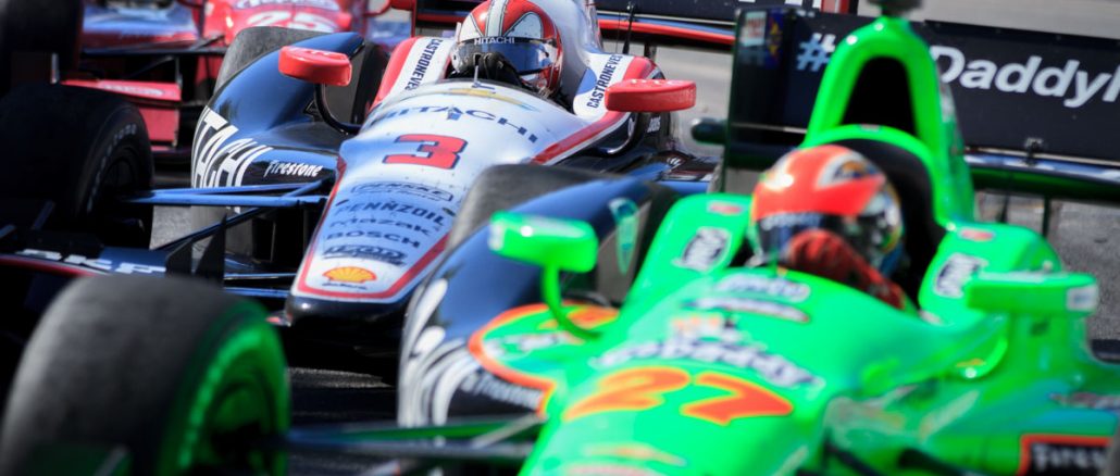 Bumbper to bumper racing at the Honda Indy Race 1 in Toronto. Pictured here: Canadian driver James Hinchcliffe followed closely by Brazilian driver Helio Castroneves and American driver Marco Andretti.