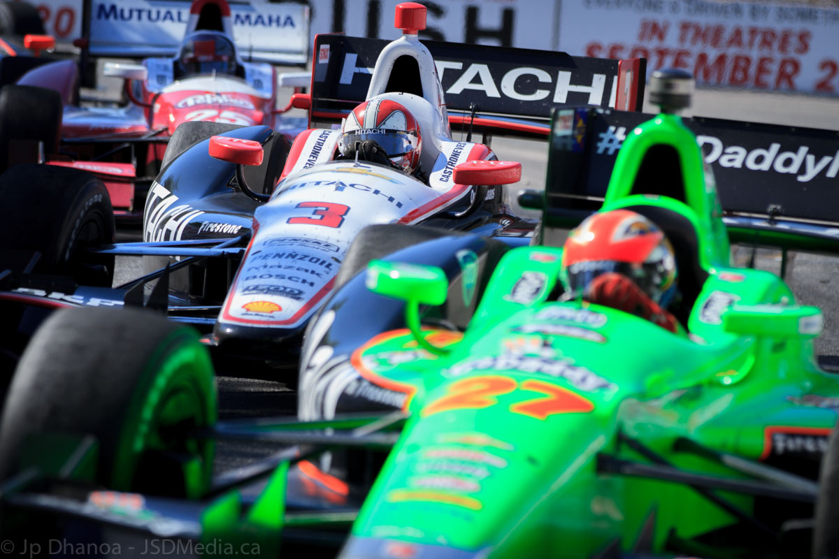 Bumbper to bumper racing at the Honda Indy Race 1 in Toronto. Pictured here: Canadian driver James Hinchcliffe followed closely by Brazilian driver Helio Castroneves and American driver Marco Andretti. Bumbper to bumper racing at the Honda Indy Race 1 in Toronto. Pictured here: Canadian driver James Hinchcliffe followed closely by Brazilian driver Helio Castroneves and American driver Marco Andretti.