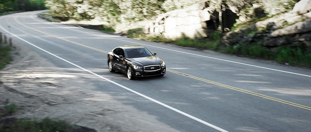 The 2014 Infiniti Q50 on a scenic by road in Ontario's cottage country