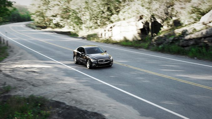 The 2014 Infiniti Q50 on a scenic by road in Ontario's cottage country