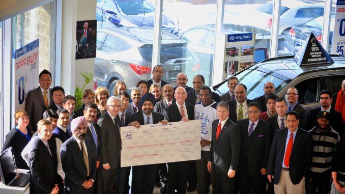 Nav Bhatia, dealer principal of Mississauga Hyundai, presents a $22,063 donation for the Hyundai Hockey Helpers initiative to Hyundai Auto Canada Corp. President and CEO Steve Kelleher, Hyundai Hockey Helpers Ambassador Karl Subban, and KidSport Canada representatives.