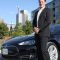 Windmill Developments co-founder Jeff Westeinde is seen with his Tesla Model S, as his company's latest project - Ottawa's Cathedral Hill condo tower, looms in the background. The environmentally-friendly developer is adding electric vehicle charging stations to its portfolio in order to cater to urban EV owners.