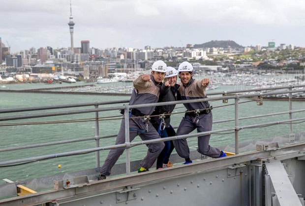 sidharth malhotra poses atop the auckland harbour bridge