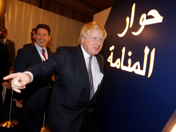 Britain's Foreign Secretary Boris Johnson (R) arrives at the IISS Regional Security Summit "The Manama Dialogue" in Manama, Bahrain
