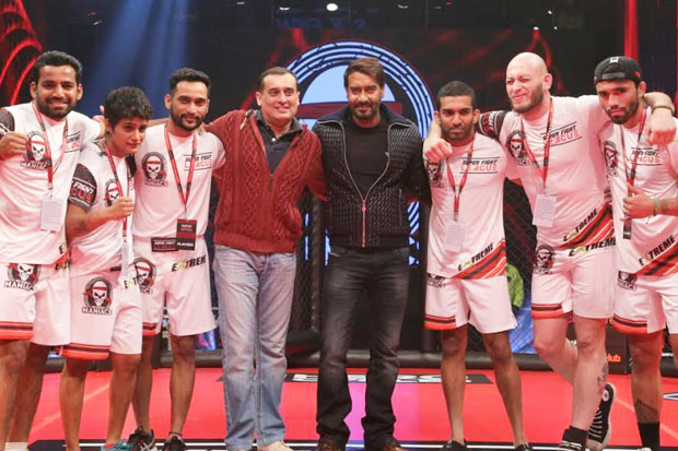 ajay devgn poses with his team at the inauguration of super fight league