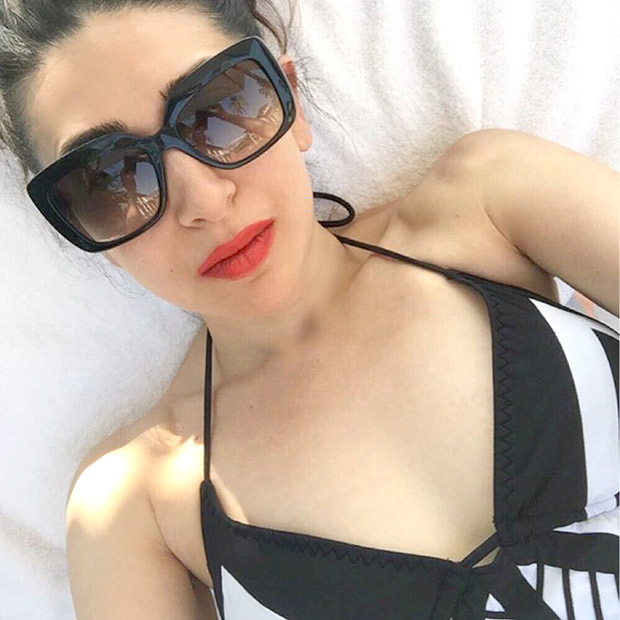 Karisma Kapoor beats the heat in a hot monochrome swimsuit