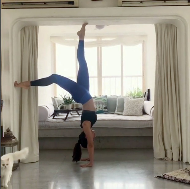 OMG! Flexible hottie Jacqueline Fernandez walks upside down in this cool video!