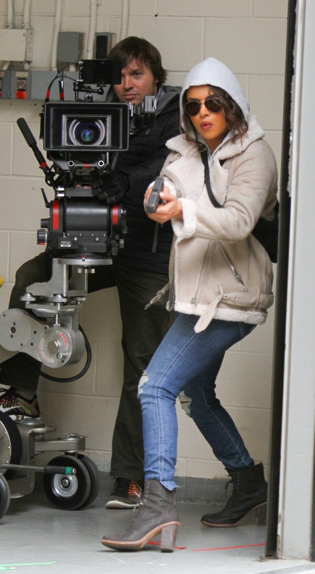 Check out Priyanka Chopra points a gun at someone while shooting an action scene for Quantico on the streets of NYC