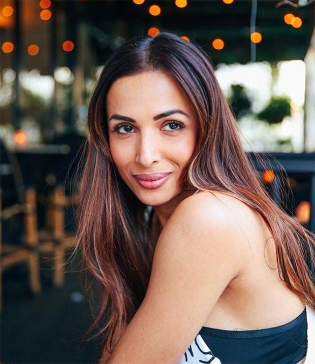 vacation goals! malaika arora is out shopping and doing yoga on the beach in los angeles!