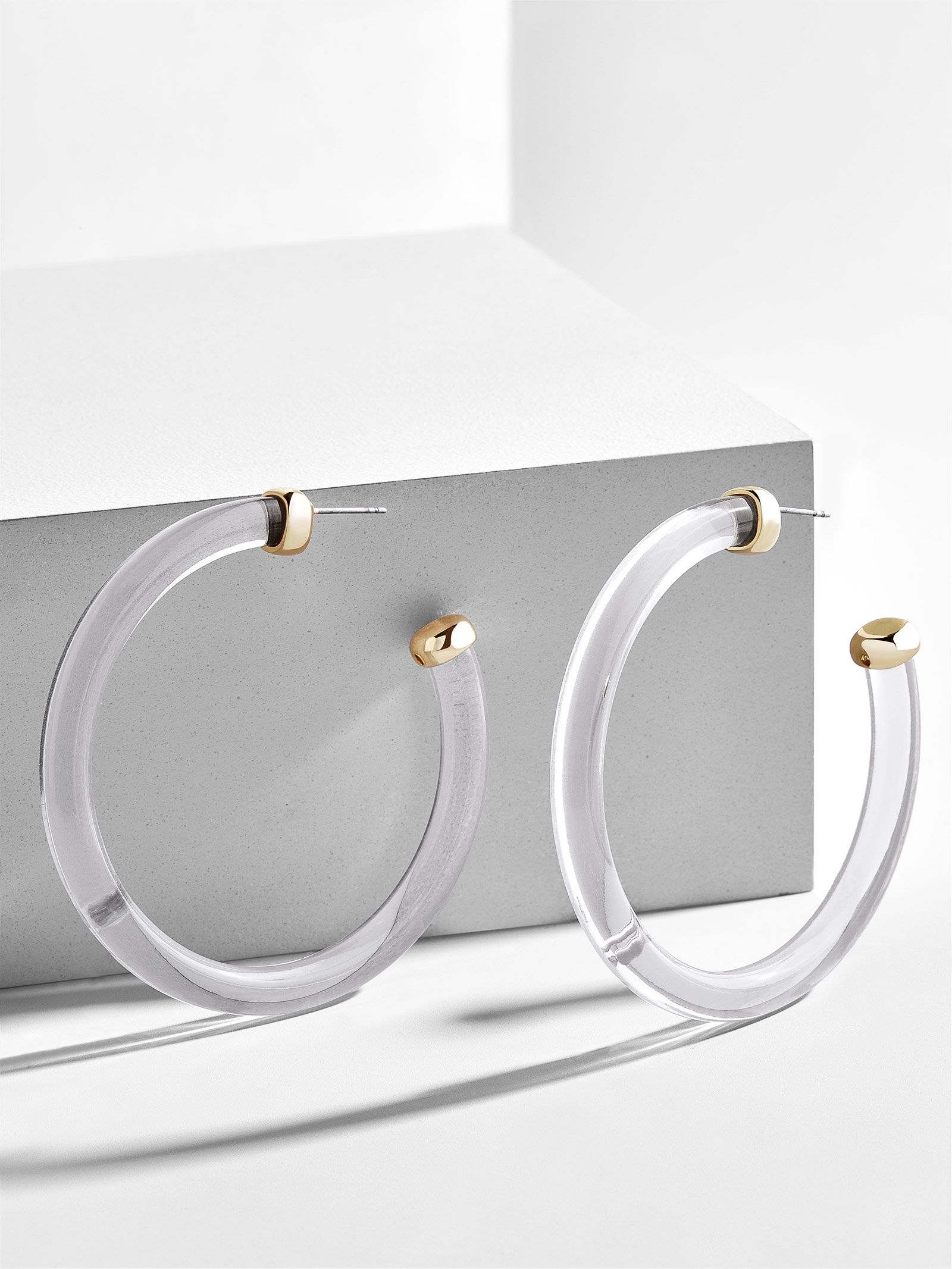 lucite hoop earrings are all the rage & we want in