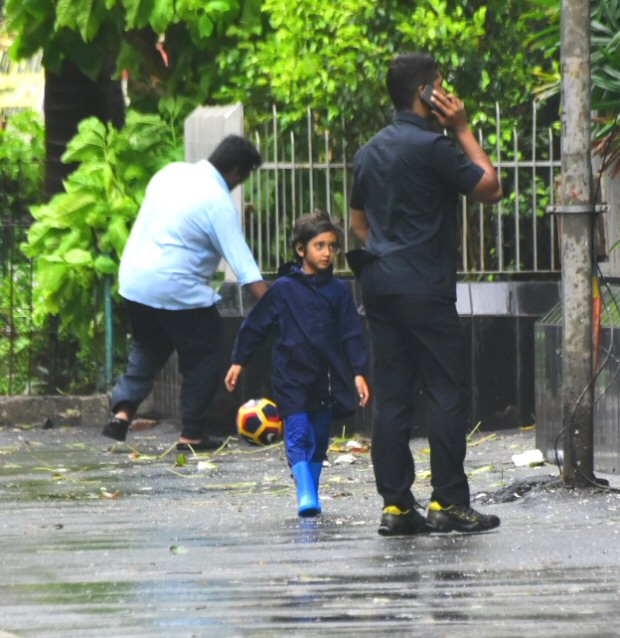 Aamir Khan’s son Azad enjoys a RARE outing in rain, plays some football on the streets of Mumbai (see pics)
