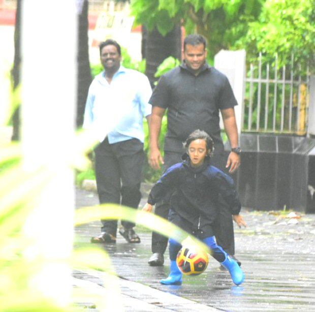 Aamir Khan’s son Azad enjoys a RARE outing in rain, plays some football on the streets of Mumbai (see pics)