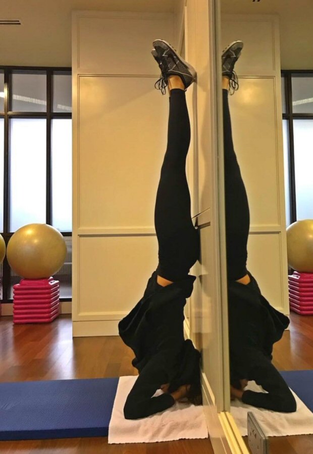 Deepika Padukone aces the headstand with such an ease giving major workout goals