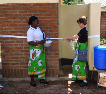 Kristy-Nowell-cutting-Ribbon-of-the-Latrine-at-St.-Luke’s-Hospital.