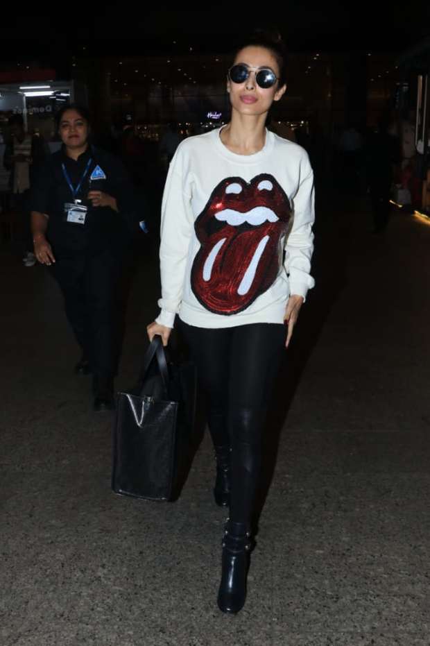 Malaika Arora in Madeworn Rolling Stones sweatshirt at the airport (2)