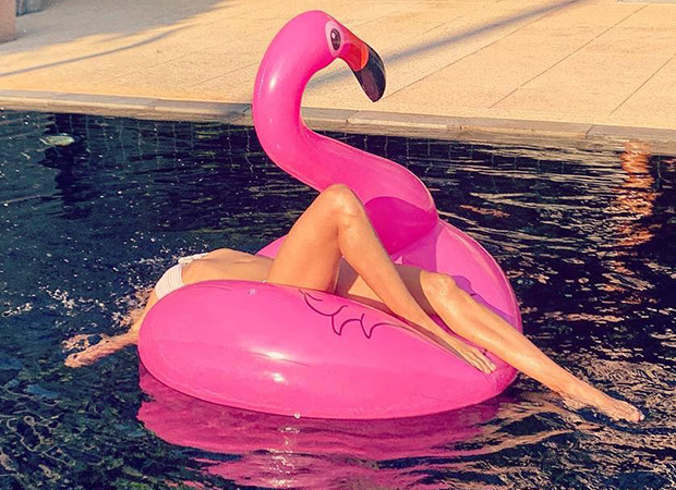 super sensuous lisa haydon dives into a pool in a pristine white bikini, gives chilled out weekend goals