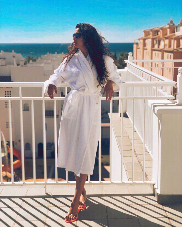 HOT! Keerthy Suresh looks absolutely stunning in a bathrobe as she flaunts her svelte frame! 