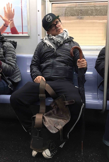 name this celebrity asleep on the subway
