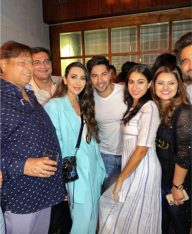 Varun Dhawan and Sara Ali Khan strike a pose with original Coolie No 1 girl Karisma Kapoor at wrap up party