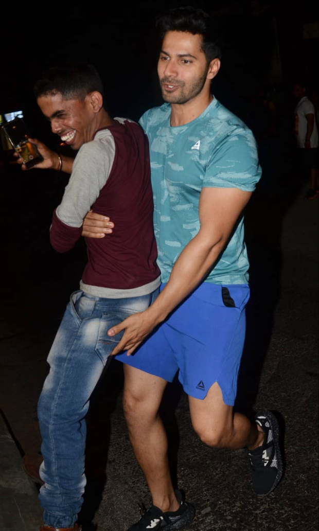 Varun Dhawan surprises a paparazzi as he lifts him his arms in this viral video 