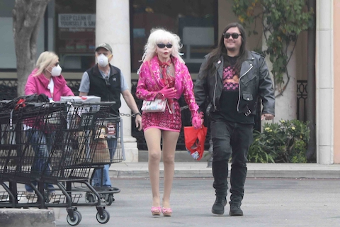 angelyne accessorizes her mask and gloves