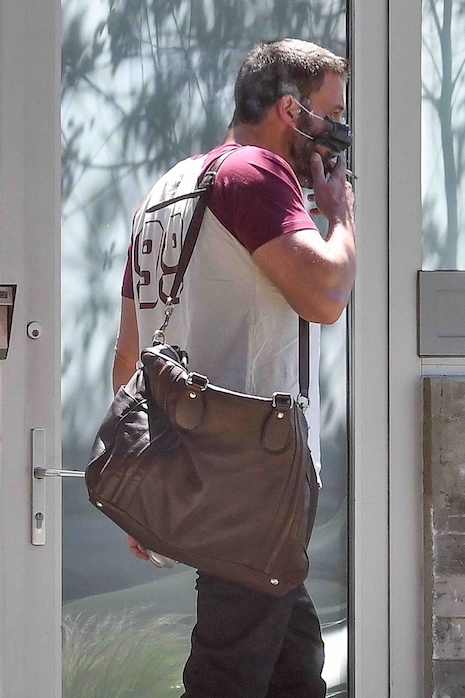 even a mask doesn’t stop ben affleck from having a smoke