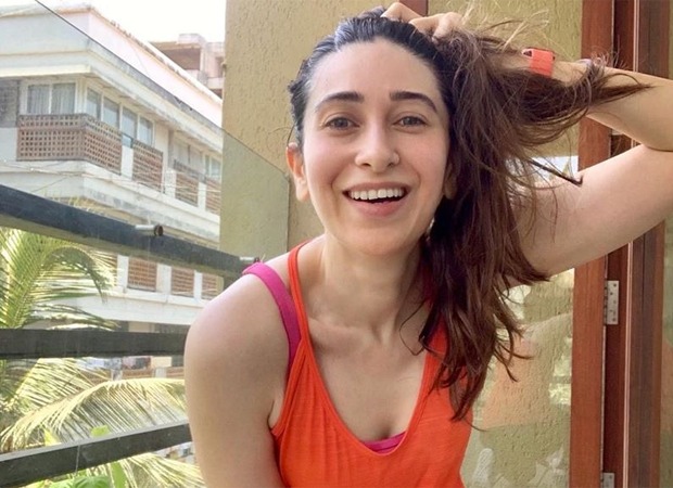karisma kapoor chills in the balcony post workout, goes ‘say squeeze’