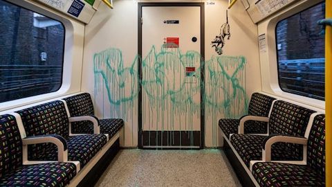 banksy art scrubbed off of london subway train