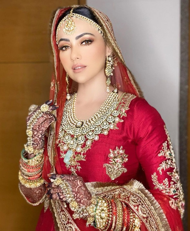 Sana Khan’s looks ethereally royal in a classic red lehenga for her Walima with Mufti Anas