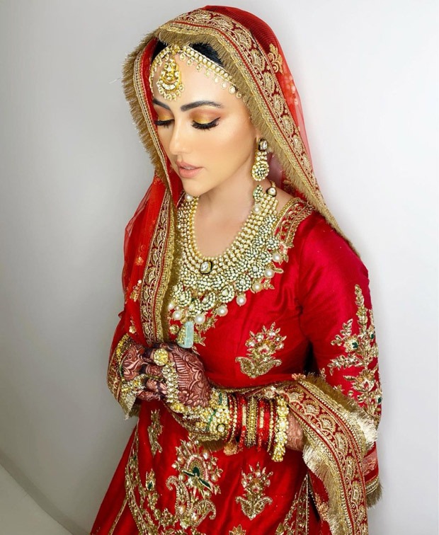 Sana Khan’s looks ethereally royal in a classic red lehenga for her Walima with Mufti Anas