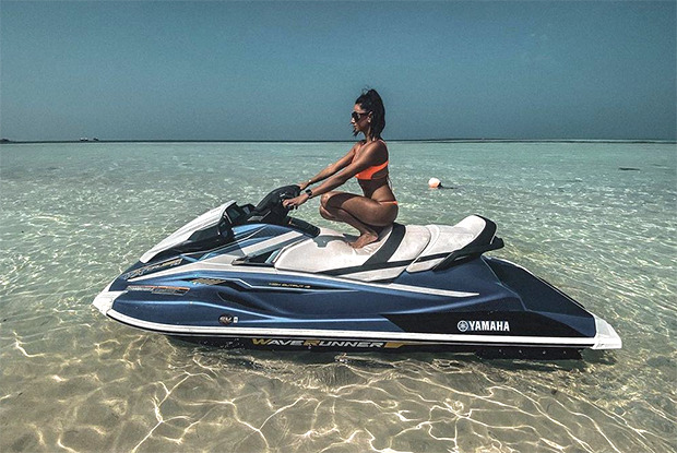 Shibani Dandekar soaks up in the sun in orange bikini while sitting on a jet-ski in Maldives