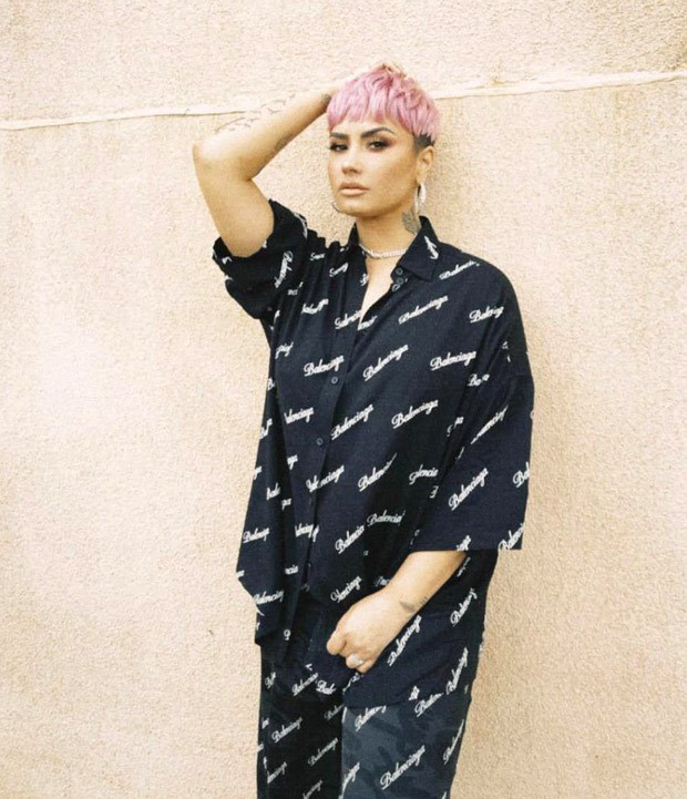 demi lovato nails the art of comfort and chic in balenciaga outfit, flaunts her pink pixie cut