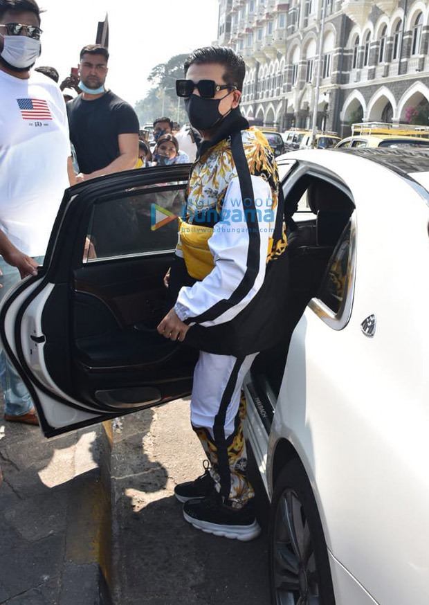 karan johar spotted at gateway of india, leaving for varun dhawan-natasha dalal’s wedding